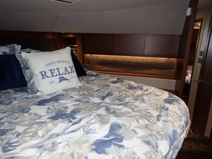  Yacht Photos Pics Luxurious bedroom interior of 2015 Sea Ray 510 Fly yacht with floral bedding and "Relax" pillow.