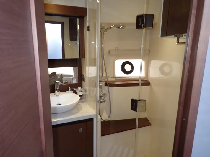  Yacht Photos Pics Luxurious bathroom interior of 2015 Sea Ray 510 Fly yacht with modern fixtures.
