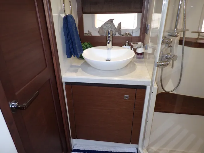  Yacht Photos Pics Luxurious bathroom interior of 2015 Sea Ray 510 Fly yacht with modern sink and shower.