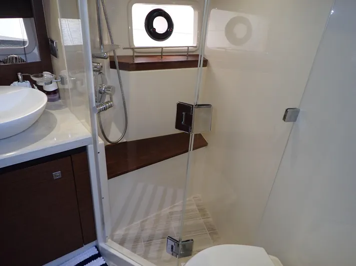  Yacht Photos Pics Luxurious bathroom in 2015 Sea Ray 510 Fly yacht with modern shower and sink.