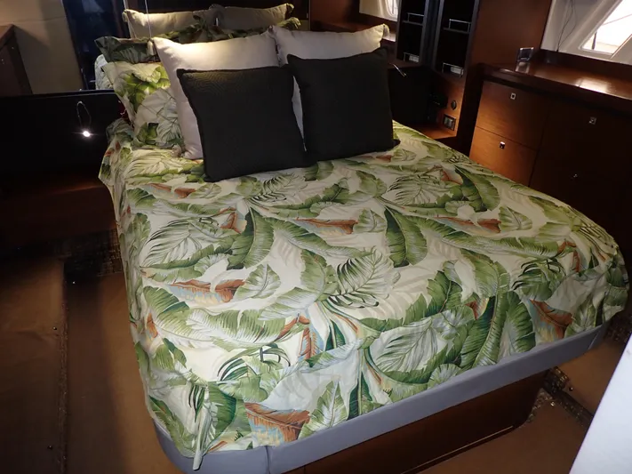  Yacht Photos Pics Luxurious bedroom interior of 2015 Sea Ray 510 Fly yacht with tropical-themed bedding.