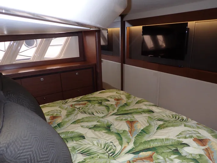  Yacht Photos Pics Luxurious cabin interior of 2015 Sea Ray 510 Fly yacht with tropical bedding.