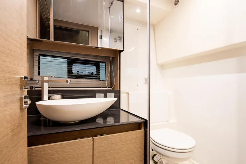 Margie Yacht Photos Pics Modern bathroom interior on 2018 Prestige 460 yacht, featuring sleek sink and compact design.