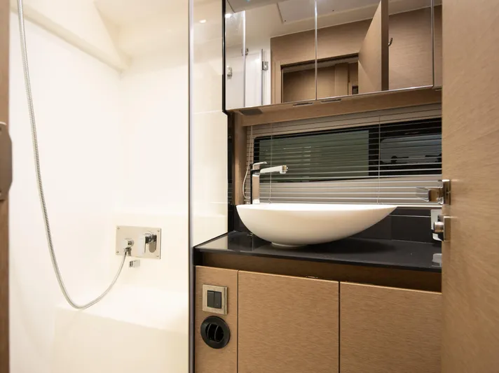 Margie Yacht Photos Pics Luxurious bathroom interior of 2018 Prestige 460 yacht with modern sink and fixtures.
