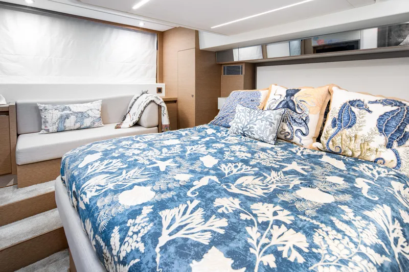 Margie Yacht Photos Pics Luxurious bedroom interior of 2018 Prestige 460 yacht with nautical-themed bedding.