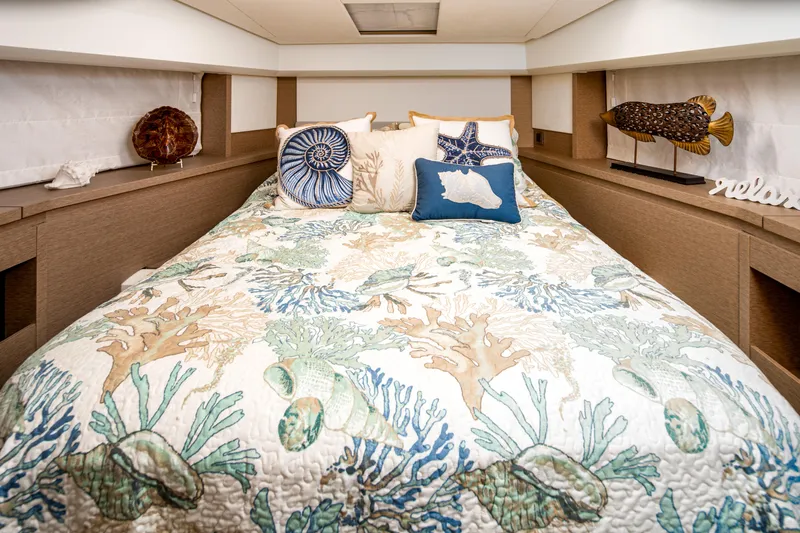 Margie Yacht Photos Pics Luxurious bedroom interior of 2018 Prestige 460 yacht with nautical-themed decor.