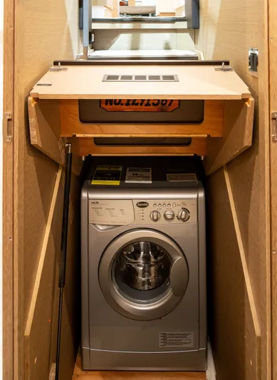 Margie Yacht Photos Pics Washing machine in a 2018 Prestige 460 yacht interior compartment.