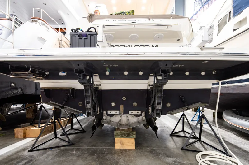 Margie Yacht Photos Pics Rear view of a 2018 Prestige 460 yacht on stands in a showroom.