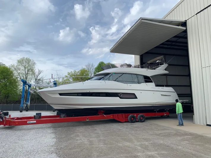 Margie Yacht Photos Pics 2018 Prestige 460 yacht on red trailer outside large storage facility.