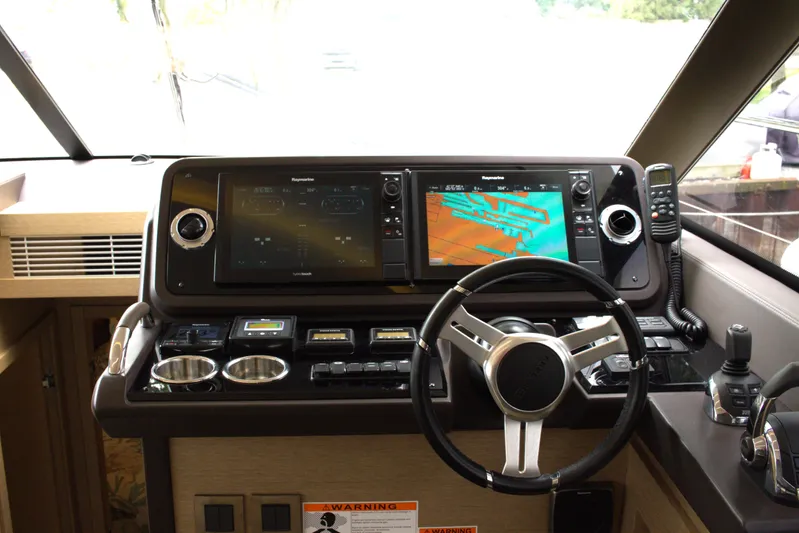 Margie Yacht Photos Pics Helm of 2018 Prestige 460 yacht with advanced navigation systems and controls.