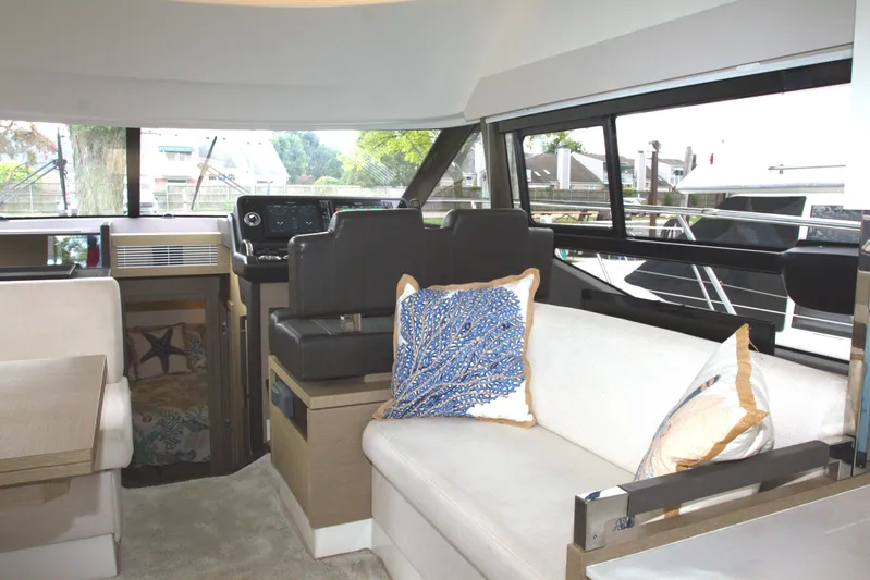 Margie Yacht Photos Pics Luxurious interior of 2018 Prestige 460 yacht with modern seating and decor.