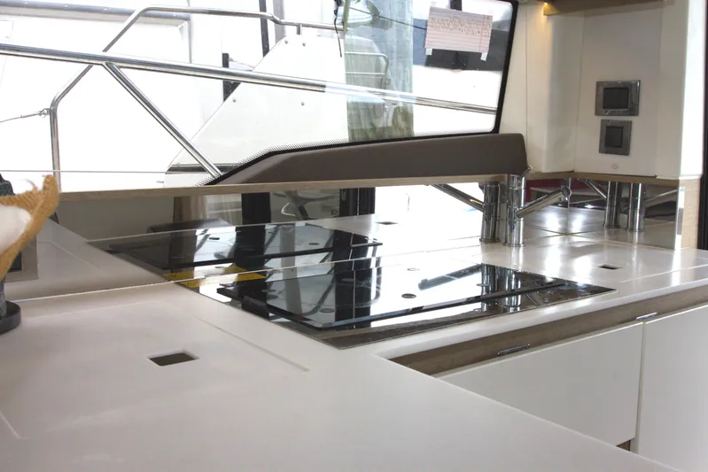 Margie Yacht Photos Pics Modern kitchen area on a 2018 Prestige 460 yacht, featuring sleek countertops and appliances.