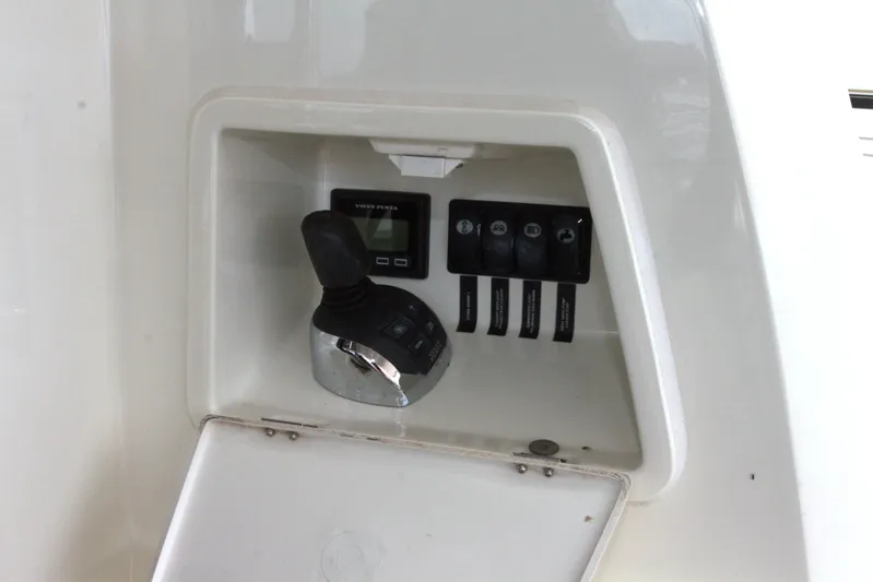 Margie Yacht Photos Pics Control panel of a 2018 Prestige 460 yacht with joystick and switches.