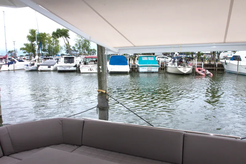 Margie Yacht Photos Pics Marina view from 2018 Prestige 460 yacht, featuring docked boats and calm waters.