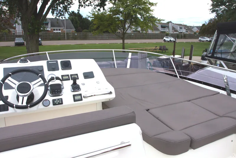 Margie Yacht Photos Pics 2018 Prestige 460 yacht helm with modern controls and spacious seating area.