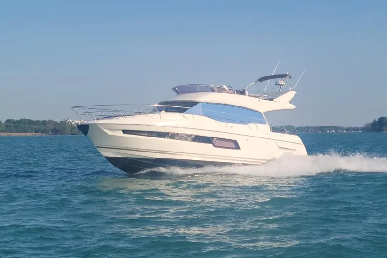 Margie Yacht Photos Pics 2018 Prestige 460 yacht cruising on open water under clear blue sky.