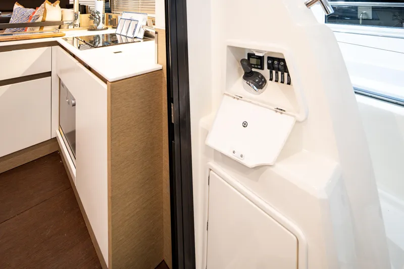 Margie Yacht Photos Pics Modern kitchen interior on a 2018 Prestige 460 yacht, featuring sleek cabinetry and appliances.