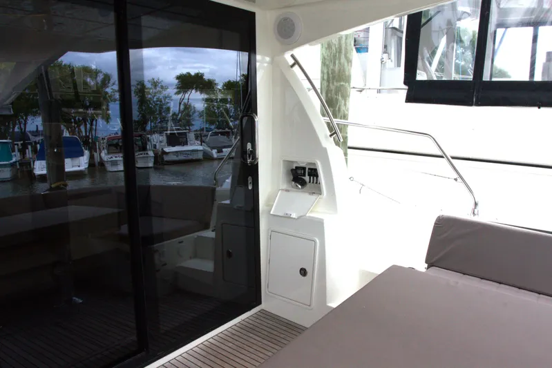 Margie Yacht Photos Pics 2018 Prestige 460 yacht interior with marina view, featuring sleek design and comfortable seating.