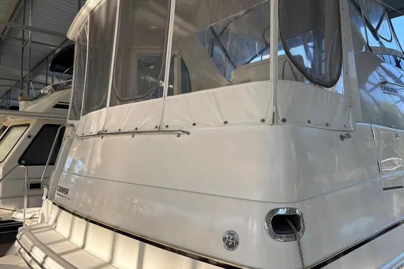  Yacht Photos Pics 2001 Carver 396 Motor Yacht in marina, featuring enclosed upper deck.