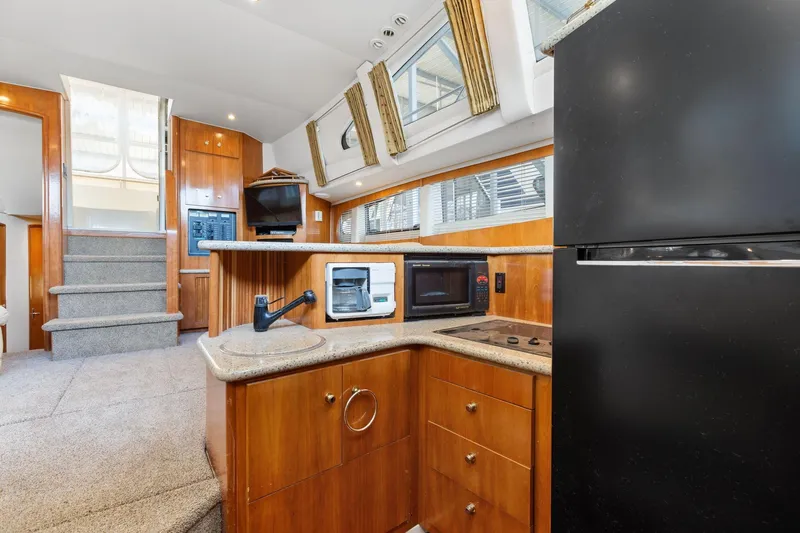  Yacht Photos Pics Interior of 2001 Carver 396 Motor Yacht with modern kitchen and appliances.