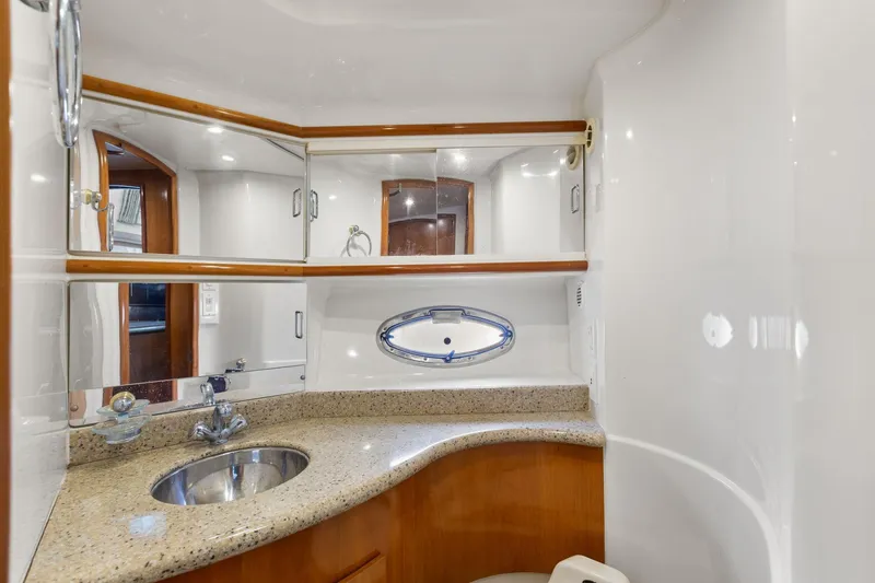  Yacht Photos Pics Luxurious bathroom in 2001 Carver 396 Motor Yacht with elegant fixtures and mirrors.