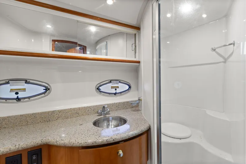  Yacht Photos Pics Luxurious bathroom in 2001 Carver 396 Motor Yacht with granite countertop and shower.