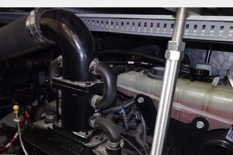  Yacht Photos Pics Engine compartment of a 2001 Carver 396 Motor Yacht, showcasing hoses and components.