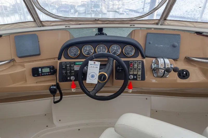  Yacht Photos Pics Helm of 2001 Carver 396 Motor Yacht with steering wheel and control panel.