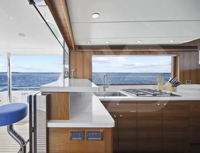 Daddo O Yacht Photos Pics Luxurious kitchen interior of 2023 Outer Reef Yachts 720 Azure Motoryacht with ocean view.