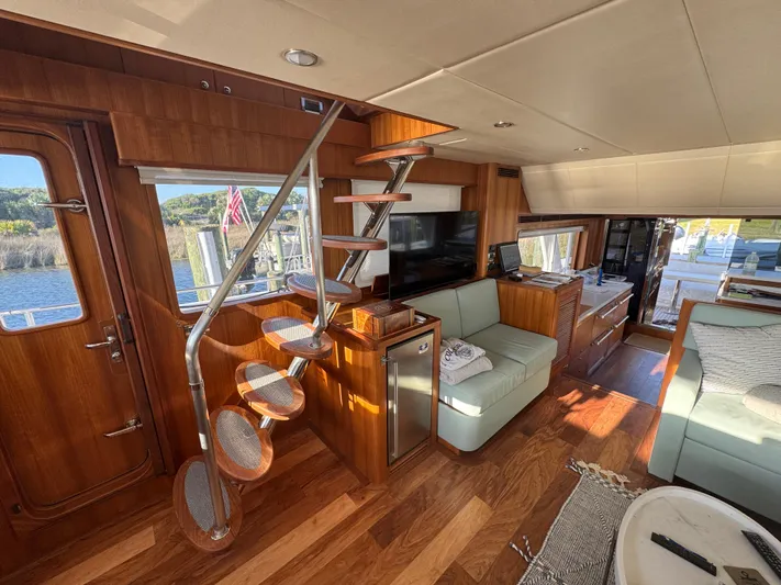 Daddo O Yacht Photos Pics Luxurious interior of 2023 Outer Reef Yachts 720 Azure Motoryacht with modern furnishings and wooden accents.