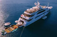 Luxurious 2008 Benetti Custom yacht with water sports equipment on a serene ocean.