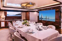 Luxurious dining area on a 2008 Benetti Custom yacht with elegant table setting.