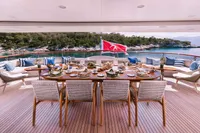 Luxurious dining setup on 2008 Benetti Custom yacht with scenic ocean view.