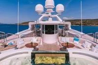 Luxurious 2008 Benetti Custom yacht deck with seating, tables, and ocean view.