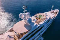 Luxurious 2008 Benetti Custom yacht with helipad and jacuzzi on open sea.