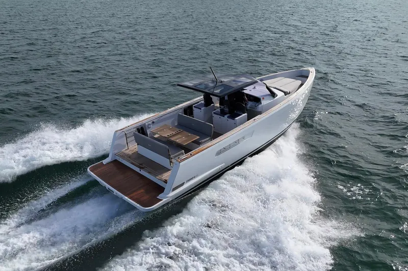  Yacht Photos Pics 2013 Fjord 40' Open yacht cruising on open water, showcasing sleek design and spacious deck.