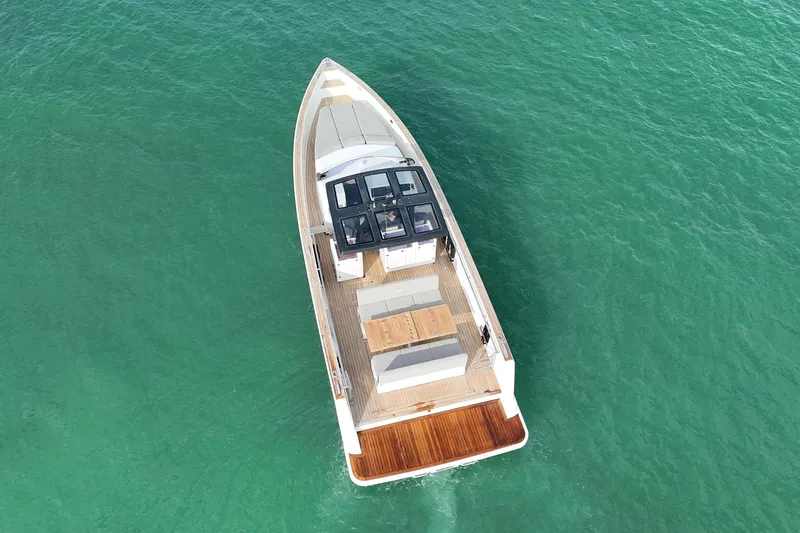  Yacht Photos Pics Aerial view of 2013 Fjord 40' Open yacht on turquoise water.