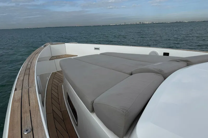  Yacht Photos Pics 2013 Fjord 40' Open yacht with spacious deck and cushioned seating on calm waters.