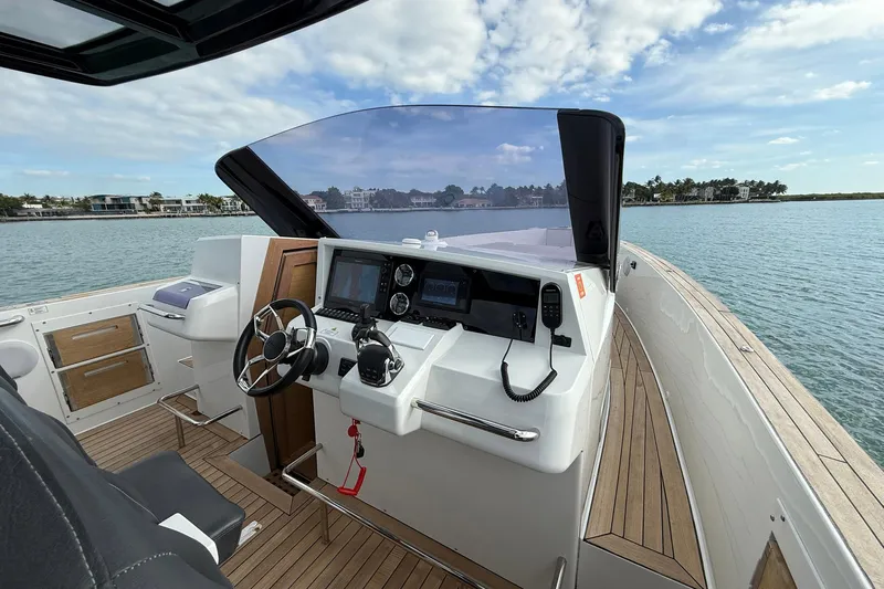  Yacht Photos Pics 2013 Fjord 40' Open yacht helm with modern controls and scenic ocean view.