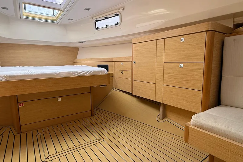  Yacht Photos Pics Luxurious cabin interior of 2013 Fjord 40' Open yacht with wooden furnishings.