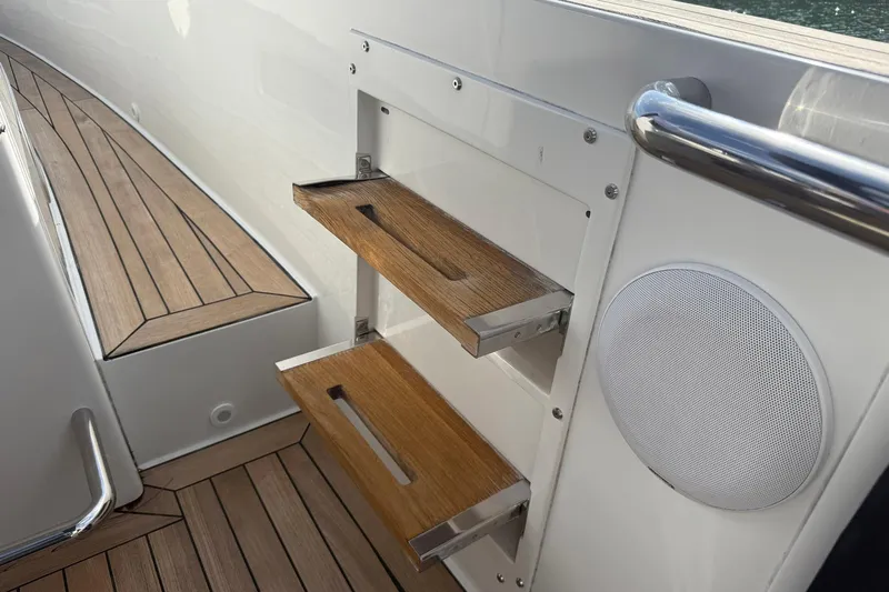  Yacht Photos Pics Teak steps and speaker on 2013 Fjord 40' Open yacht deck.