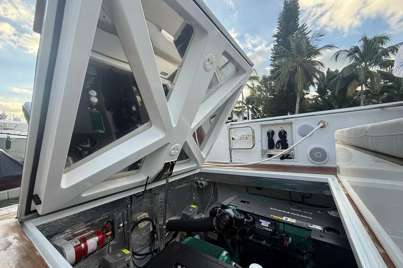  Yacht Photos Pics Engine compartment of a 2013 Fjord 40' Open yacht, showcasing mechanical components and storage.