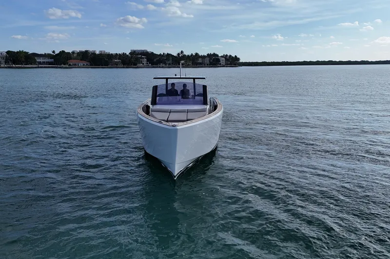  Yacht Photos Pics 2013 Fjord 40' Open yacht cruising on calm waters under a clear sky.