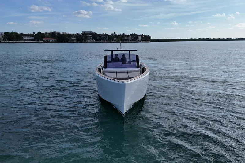  Yacht Photos Pics 2013 Fjord 40' Open yacht cruising on calm waters under a clear sky.