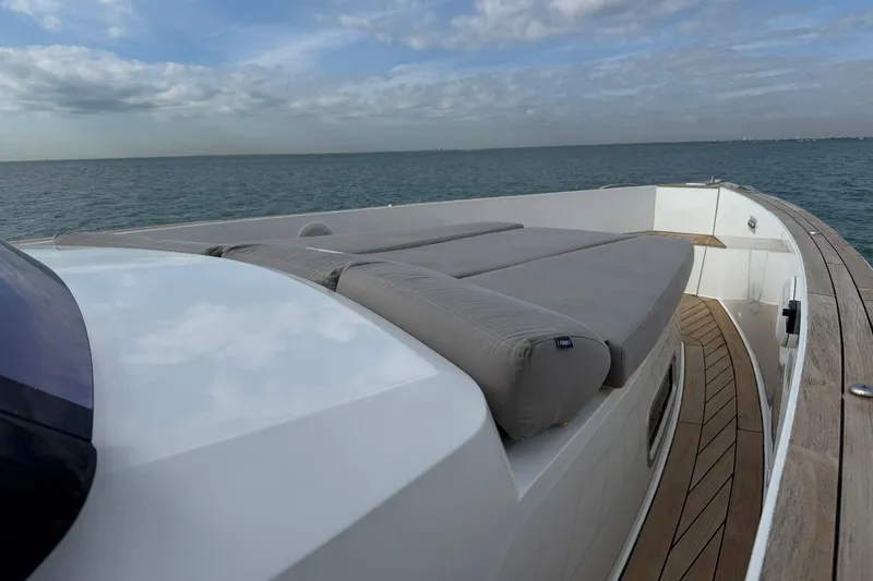  Yacht Photos Pics 2013 Fjord 40' Open yacht with sun deck, cruising on calm sea under cloudy sky.