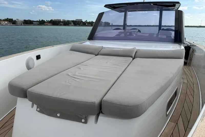  Yacht Photos Pics 2013 Fjord 40' Open yacht with spacious sunbed on deck, docked by the water.