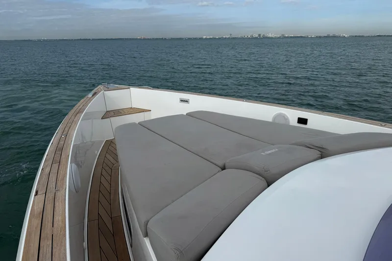  Yacht Photos Pics 2013 Fjord 40' Open yacht with spacious deck and sunbathing area on calm waters.