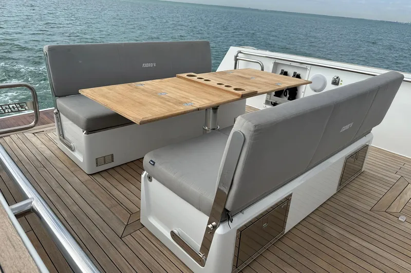  Yacht Photos Pics 2013 Fjord 40' Open yacht with teak deck and seating area on the ocean.
