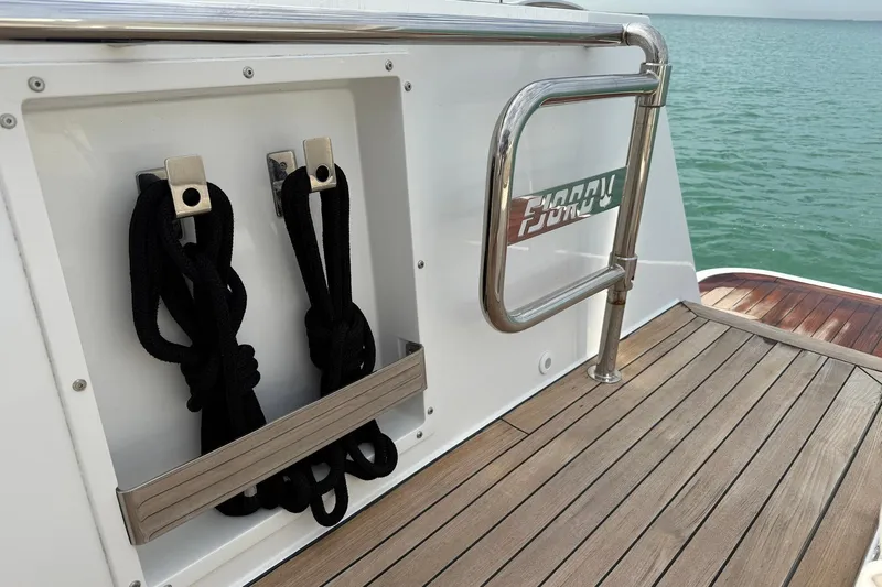  Yacht Photos Pics Deck of 2013 Fjord 40' Open yacht with rope storage and railing.