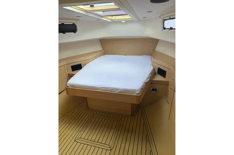  Yacht Photos Pics Interior cabin of 2013 Fjord 40' Open yacht with bed and wooden finish.
